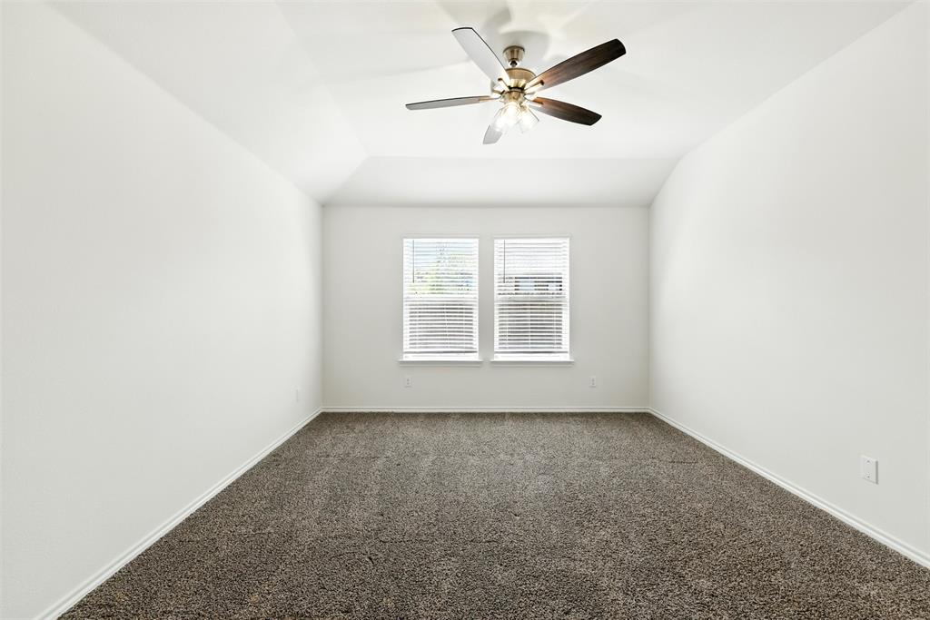 2808 Jasmine Drive Sherman, TX 75092 - Photo 27 of 38 an empty room with a window and a fan