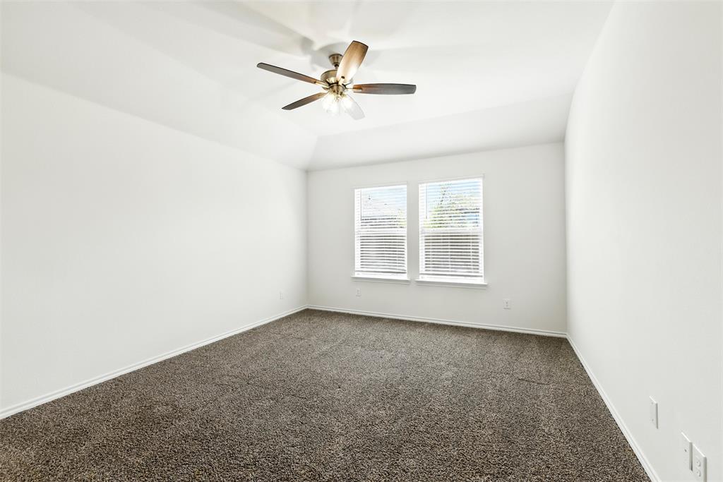 2808 Jasmine Drive Sherman, TX 75092 - Photo 28 of 38 an empty room with a window and a fan