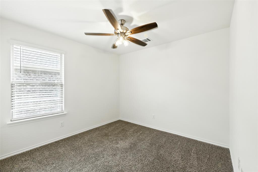 2808 Jasmine Drive Sherman, TX 75092 - Photo 29 of 38 an empty room with a window and a fan