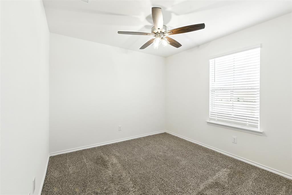 2808 Jasmine Drive Sherman, TX 75092 - Photo 33 of 38 an empty room with a window and a fan