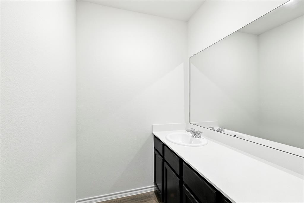 2808 Jasmine Drive Sherman, TX 75092 - Photo 38 of 38 a bathroom with a sink and a mirror