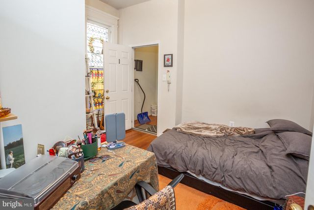 a view of a bedroom with washer and dryer