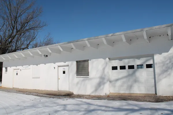 a view of a big room with large windows