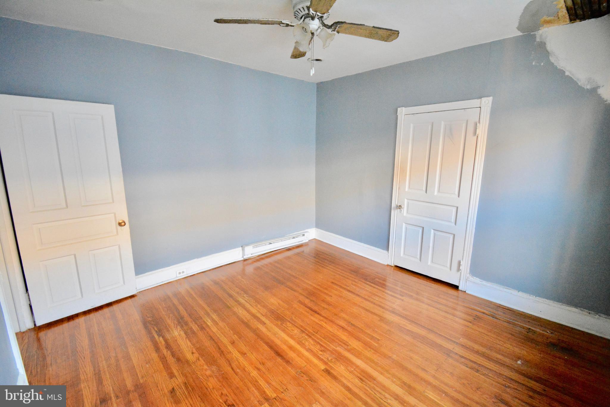 433 Hansberry Street, Unit 3 Philadelphia, PA 19144 - Photo 11 of 12 wooden floor in an empty room with a window