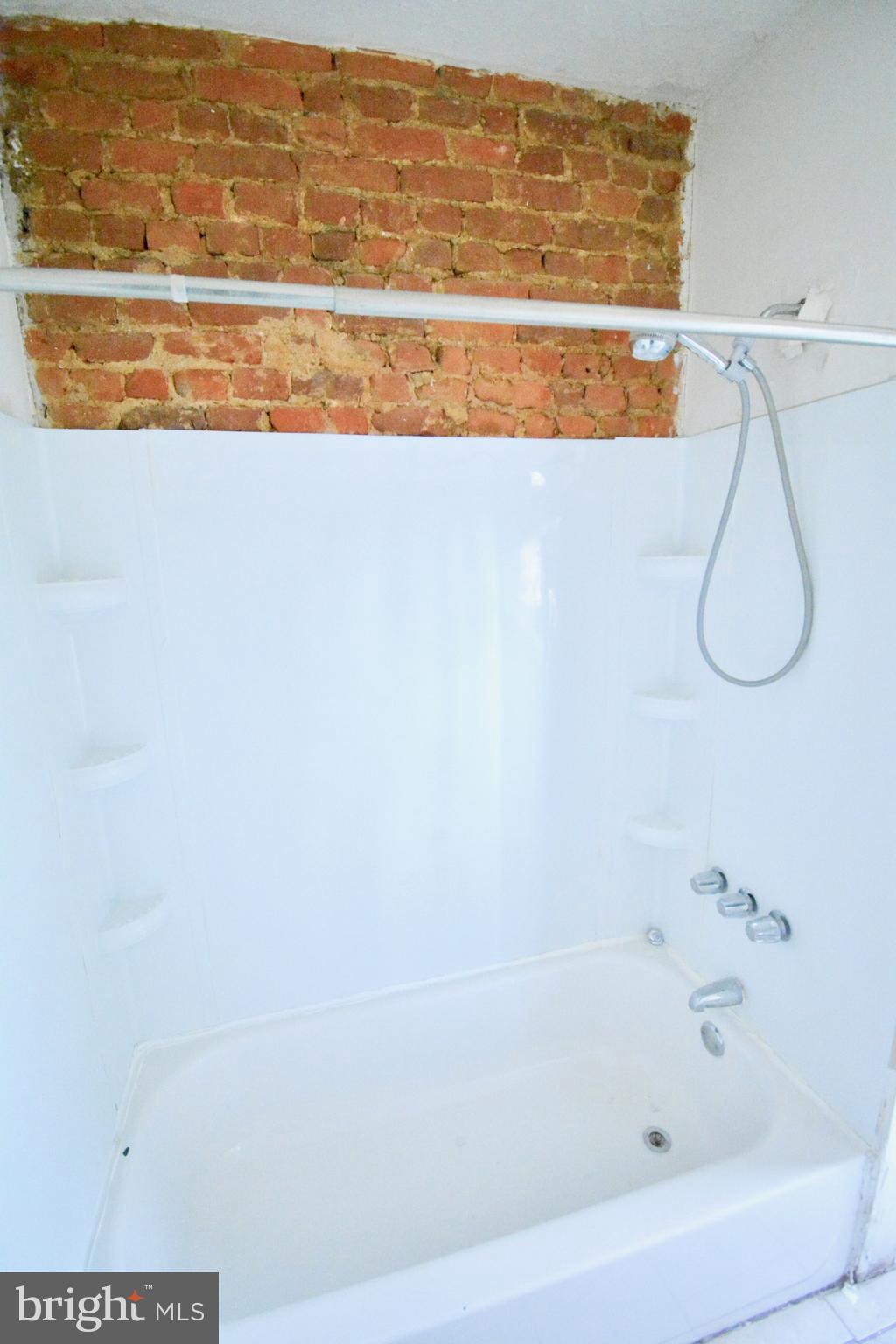 433 Hansberry Street, Unit 3 Philadelphia, PA 19144 - Photo 7 of 12 a bathroom with a shower and a window