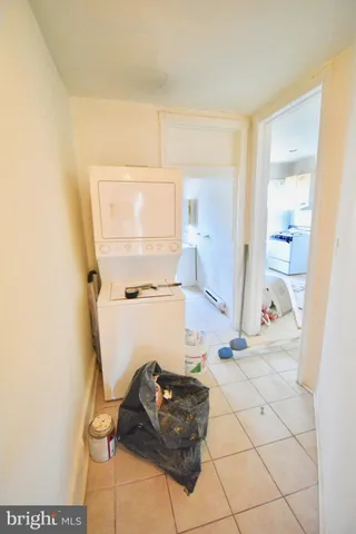 a kitchen with a refrigerator sink stove and cabinets