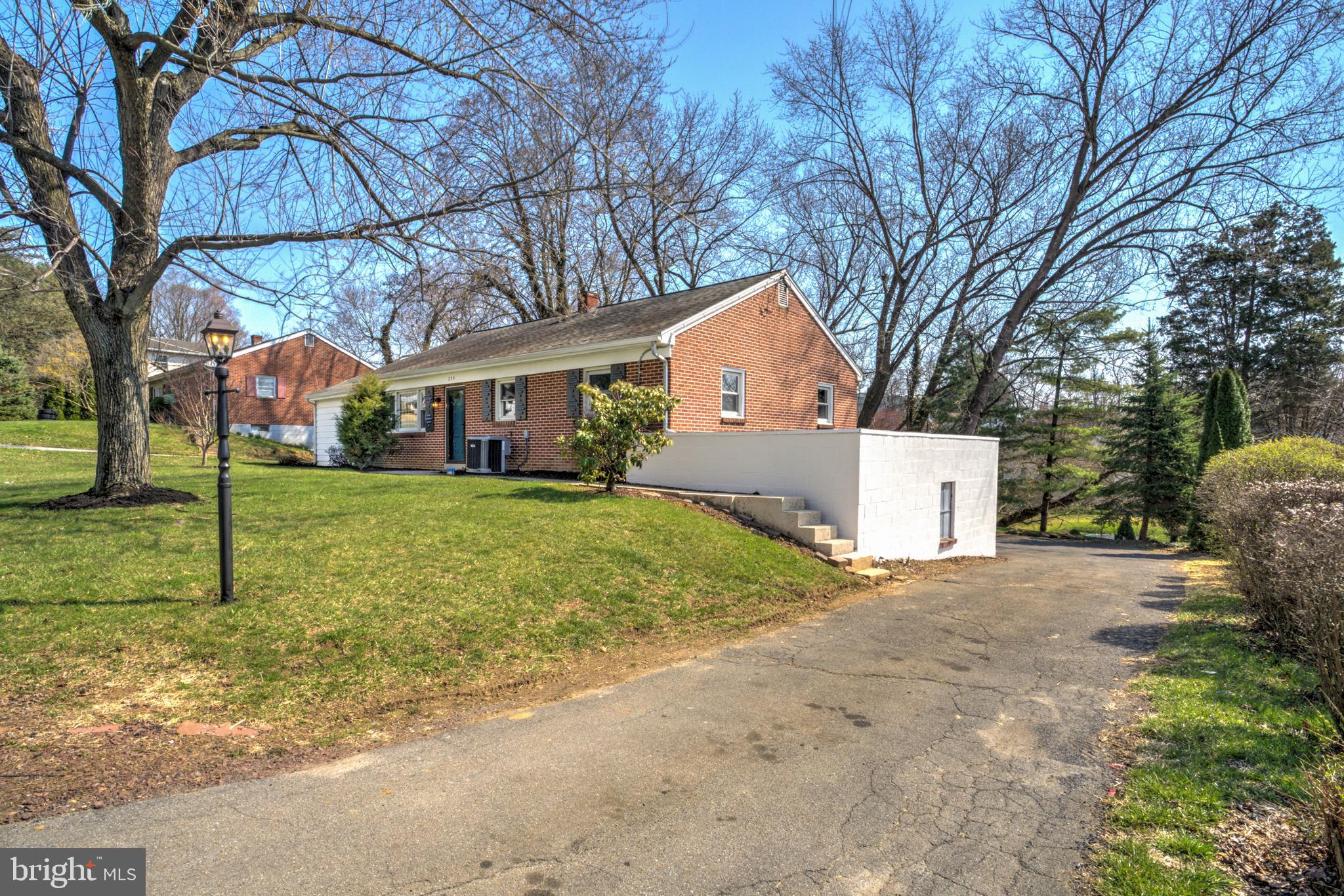 254 Blue Rock Road Millersville, PA 17551 - Photo 33 of 40 a front view of a house with a yard and trees