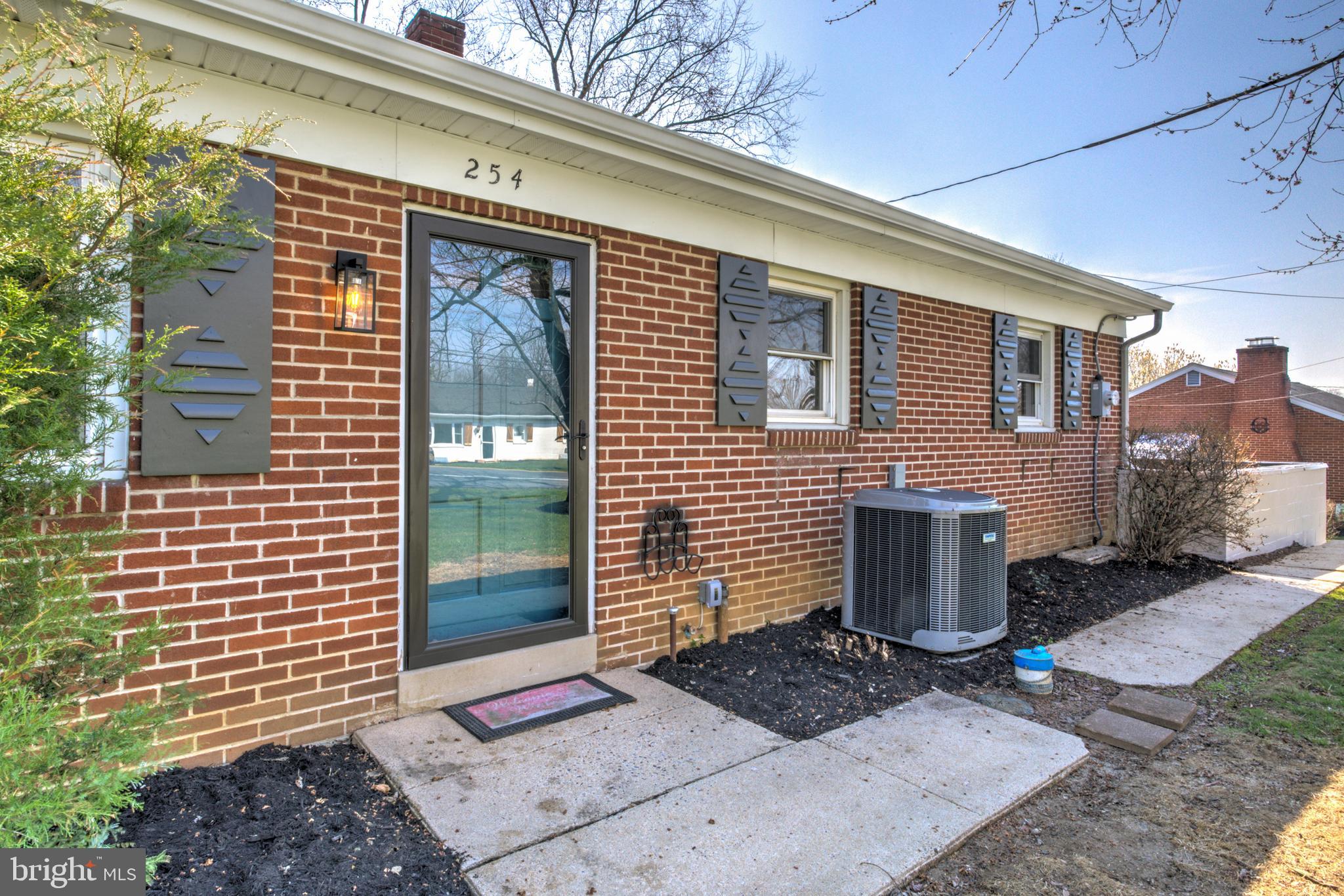 254 Blue Rock Road Millersville, PA 17551 - Photo 34 of 40 a outdoor view of a brick house with potted plants