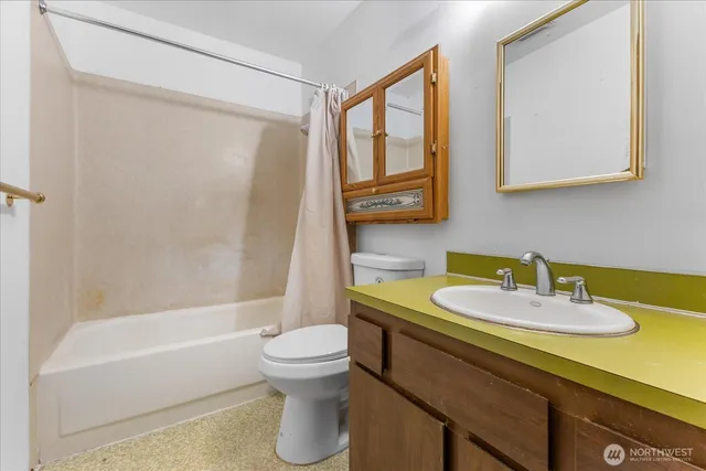 a bathroom with a sink a toilet and a bathtub