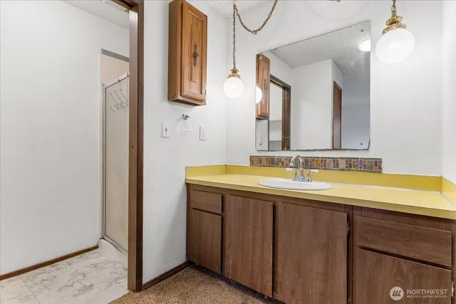 a bathroom with a sink a toilet and a bathtub