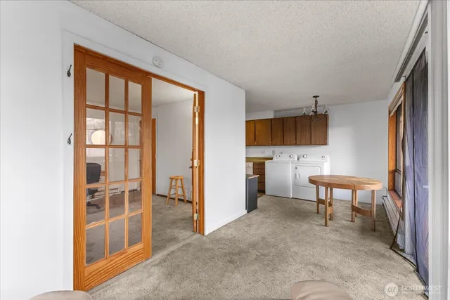 a view of a kitchen with furniture and windows