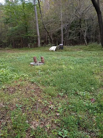 a backyard of a house with entertaining space and trampoline