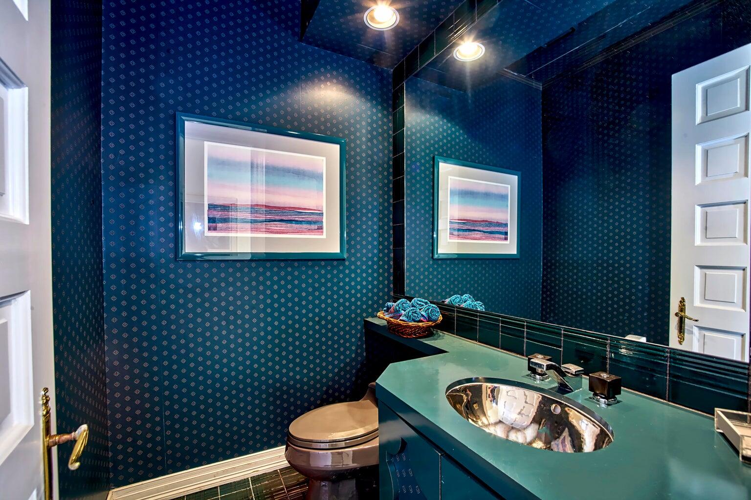 21125 Hamlin Drive Boca Raton, FL 33433 - Photo 27 of 69 a bathroom with a sink a toilet and mirror