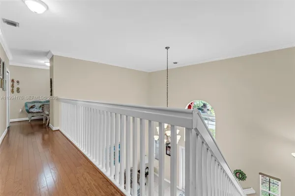 a view of a hallway with stairs
