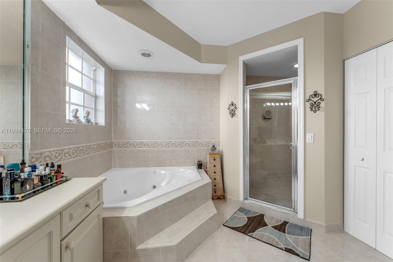 6502 Southwest 157th Court Miami, FL 33193 - Photo 20 of 51 a bathroom with a bathtub and a sink
