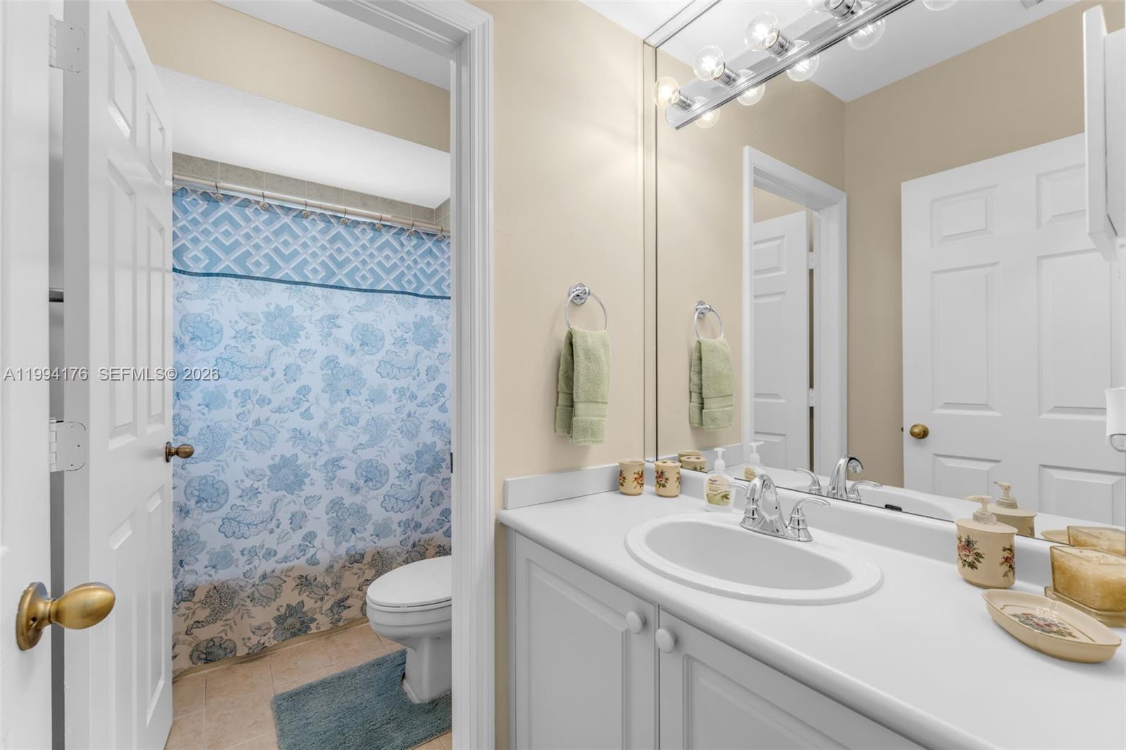 6502 Southwest 157th Court Miami, FL 33193 - Photo 26 of 51 a bathroom with a granite countertop sink toilet and shower