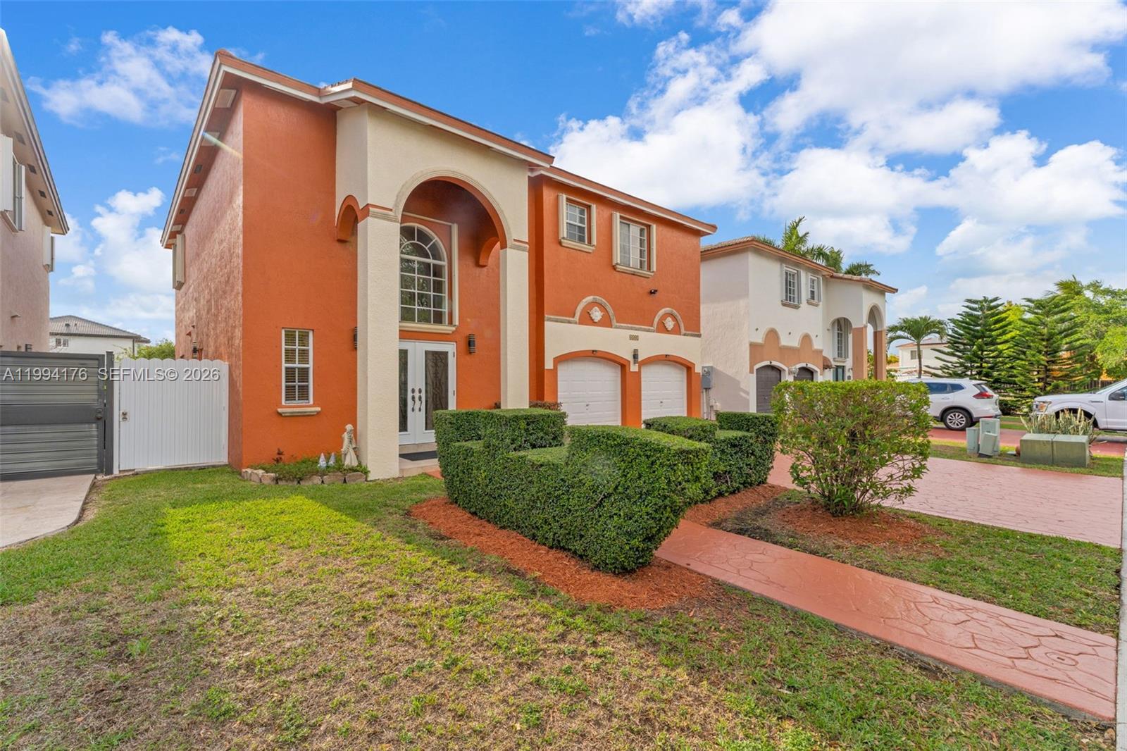 6502 Southwest 157th Court Miami, FL 33193 - Photo 3 of 51 a front view of a house with a yard