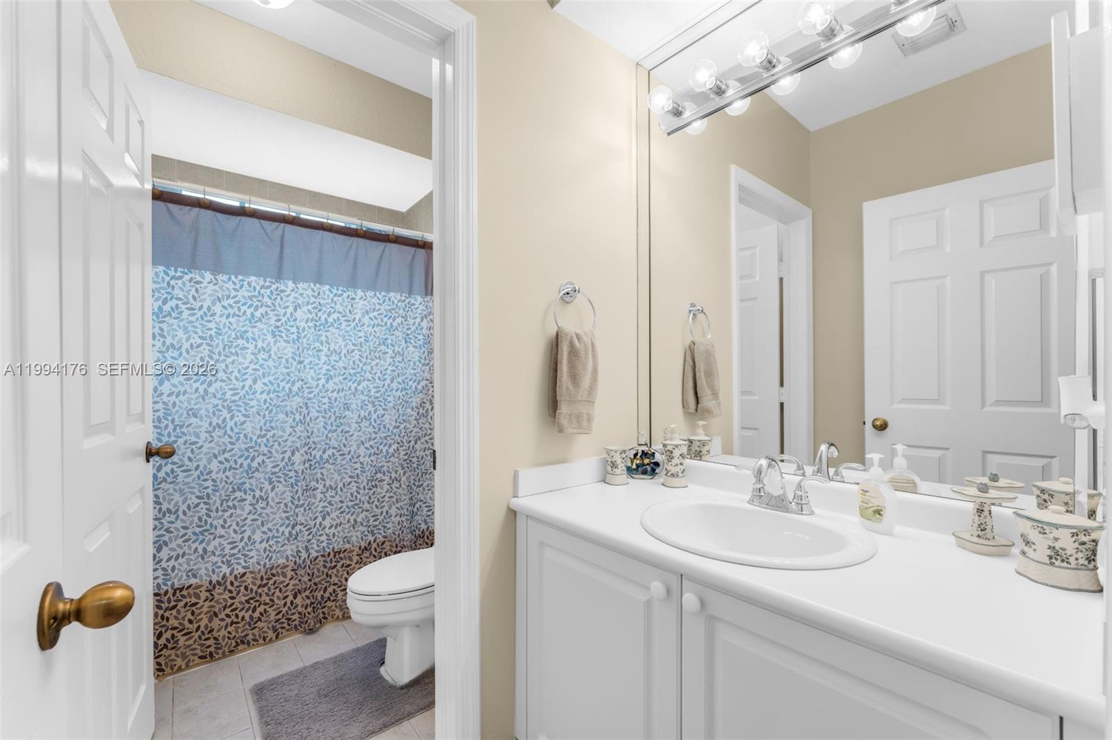 6502 Southwest 157th Court Miami, FL 33193 - Photo 31 of 51 a bathroom with a sink a toilet and shower