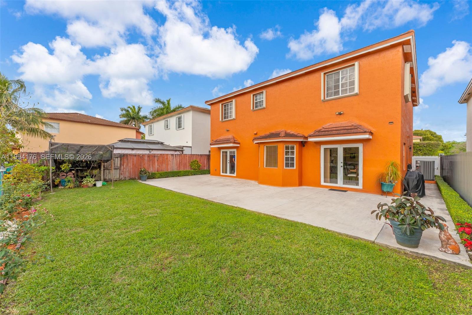 6502 Southwest 157th Court Miami, FL 33193 - Photo 36 of 51 a front view of house with yard and trees around