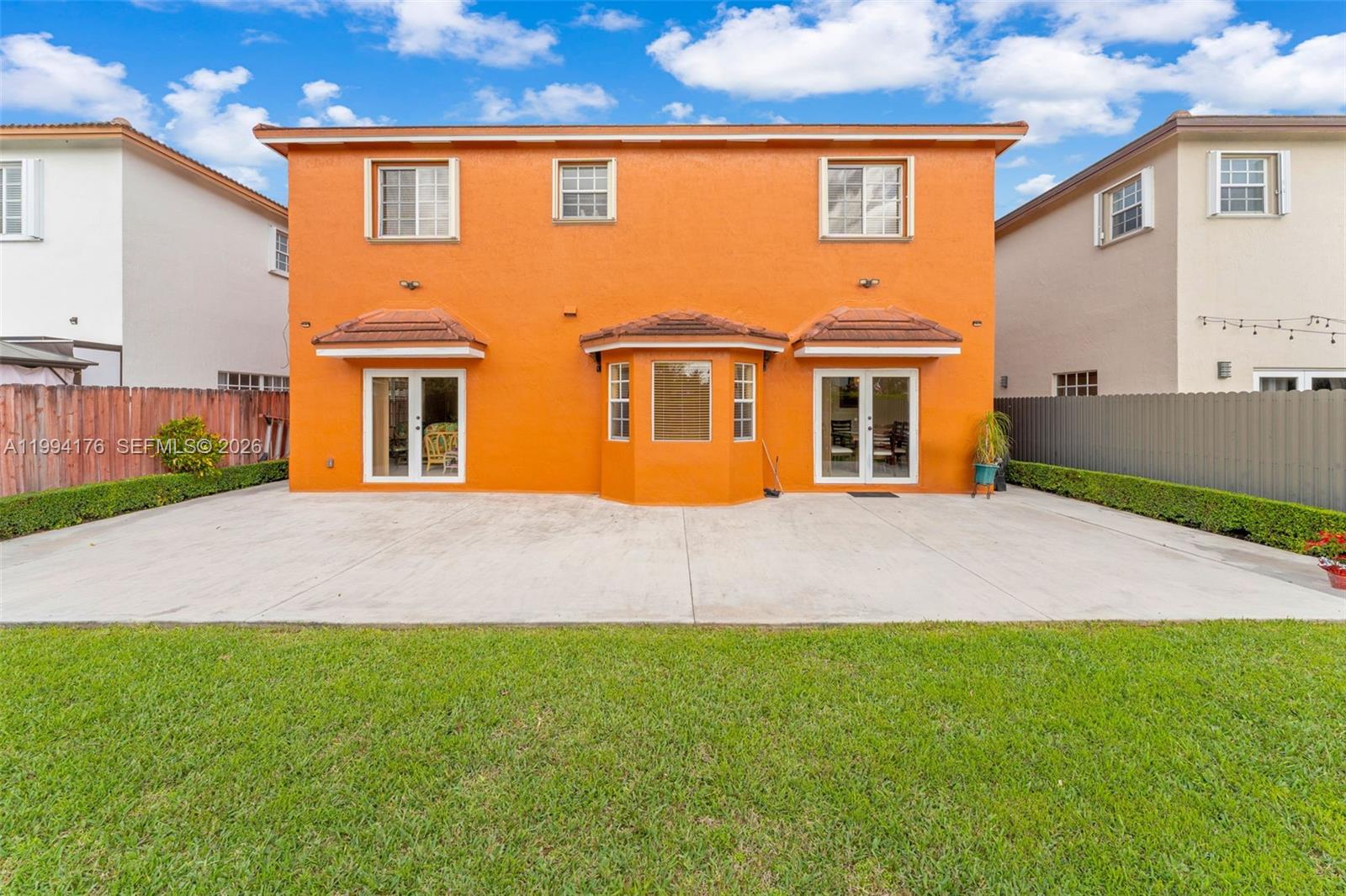 6502 Southwest 157th Court Miami, FL 33193 - Photo 38 of 51 a front view of a house with a yard and garage