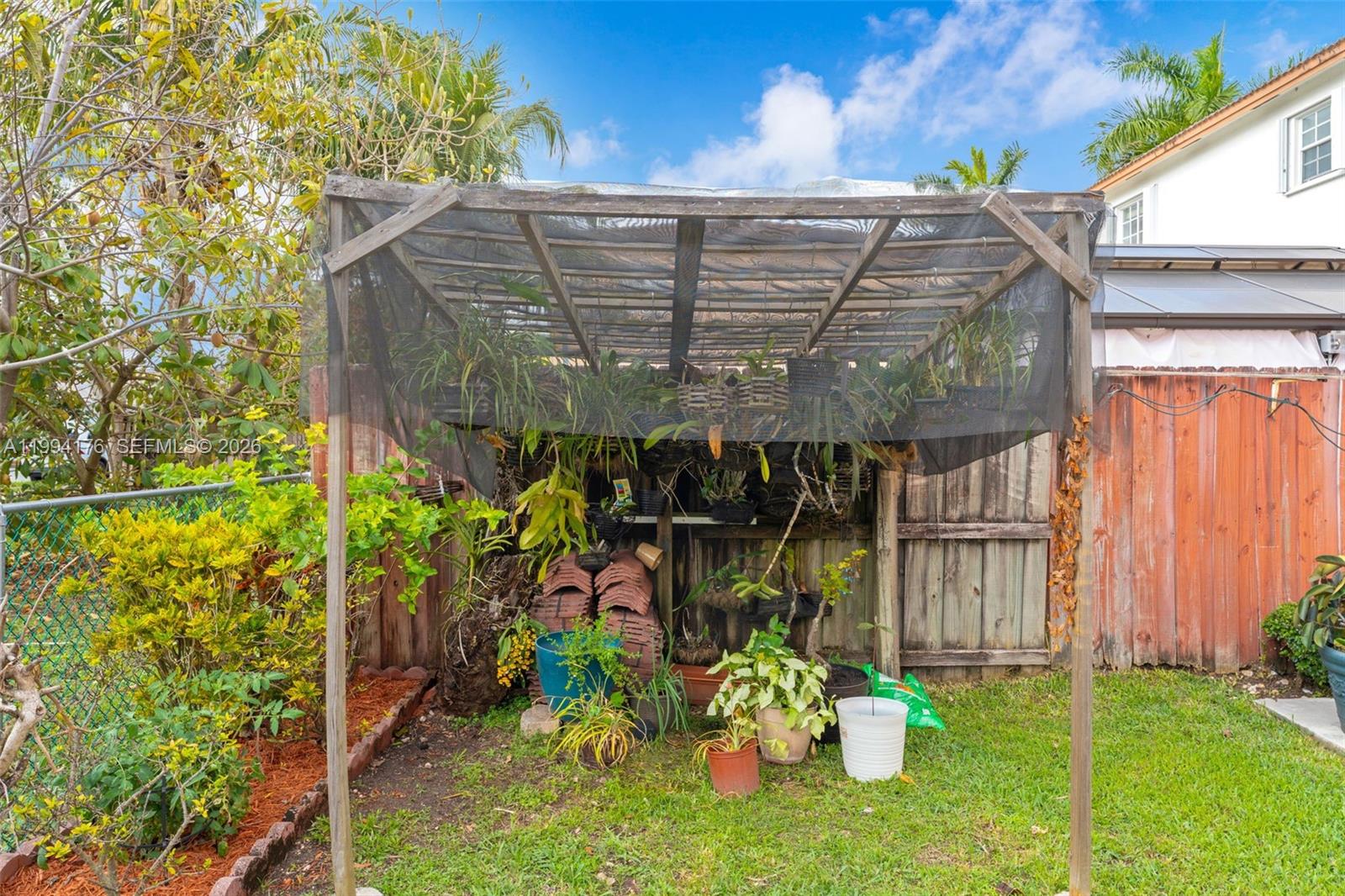 6502 Southwest 157th Court Miami, FL 33193 - Photo 39 of 51 a view of a back yard of the building