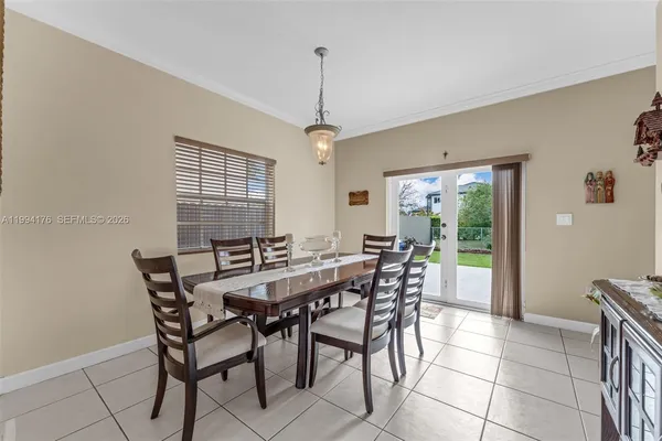 a view of a dining room with furniture window and outside view