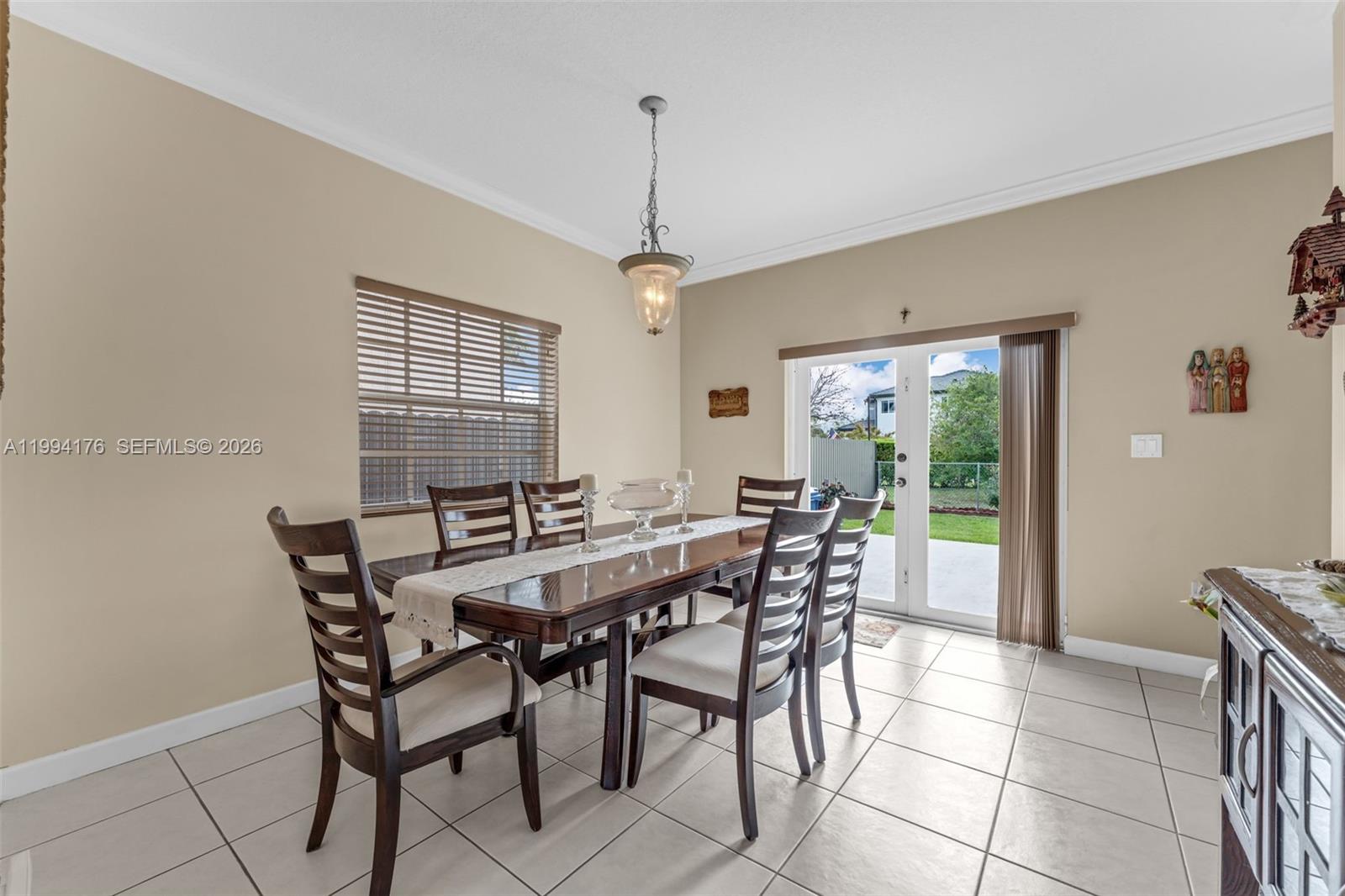6502 Southwest 157th Court Miami, FL 33193 - Photo 7 of 51 a view of a dining room with furniture window and outside view