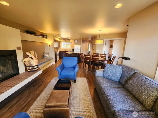a living room with furniture fireplace and flat screen tv