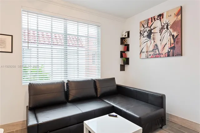 a living room with furniture and a window