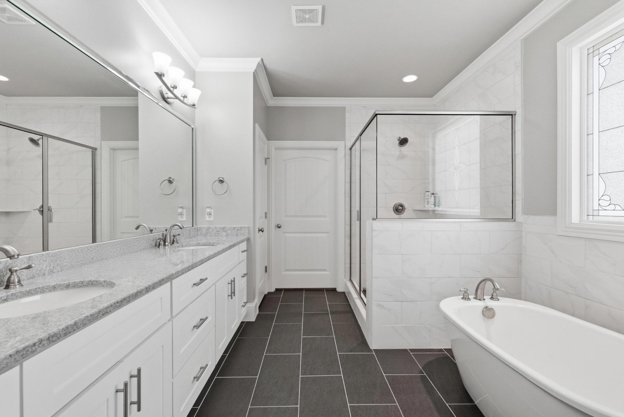 6000 Wallaby Court Spring Hill, TN 37174 - Photo 28 of 57 a bathroom with a double vanity sink mirror double and bathtub
