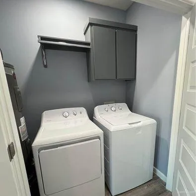 a utility room with dryer and washer