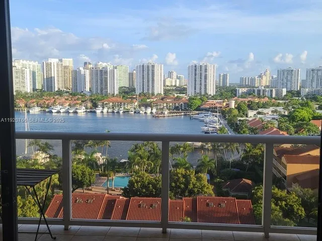 a swimming pool with outdoor seating and city view