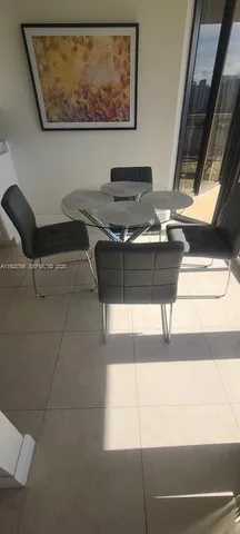 a kitchen with stainless steel appliances a stove a microwave and a refrigerator