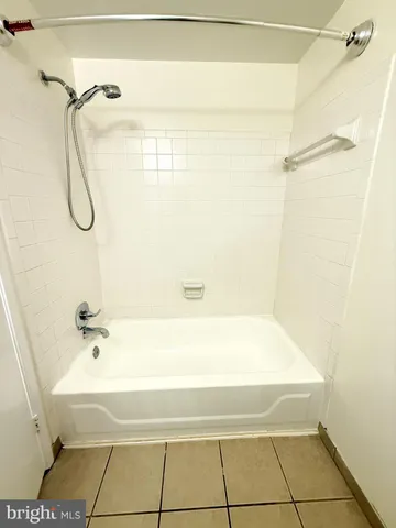 a bathroom with a bath tub and a shower
