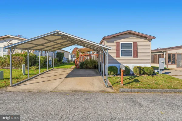 a view of backyard with a small cabin