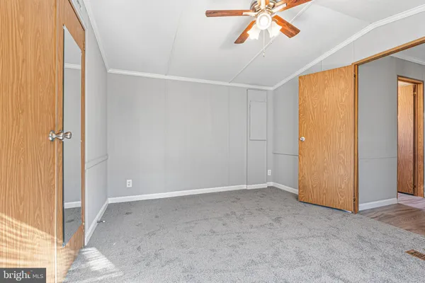 an empty room with closet area
