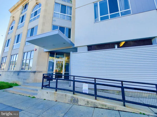 a view of a building with sitting area