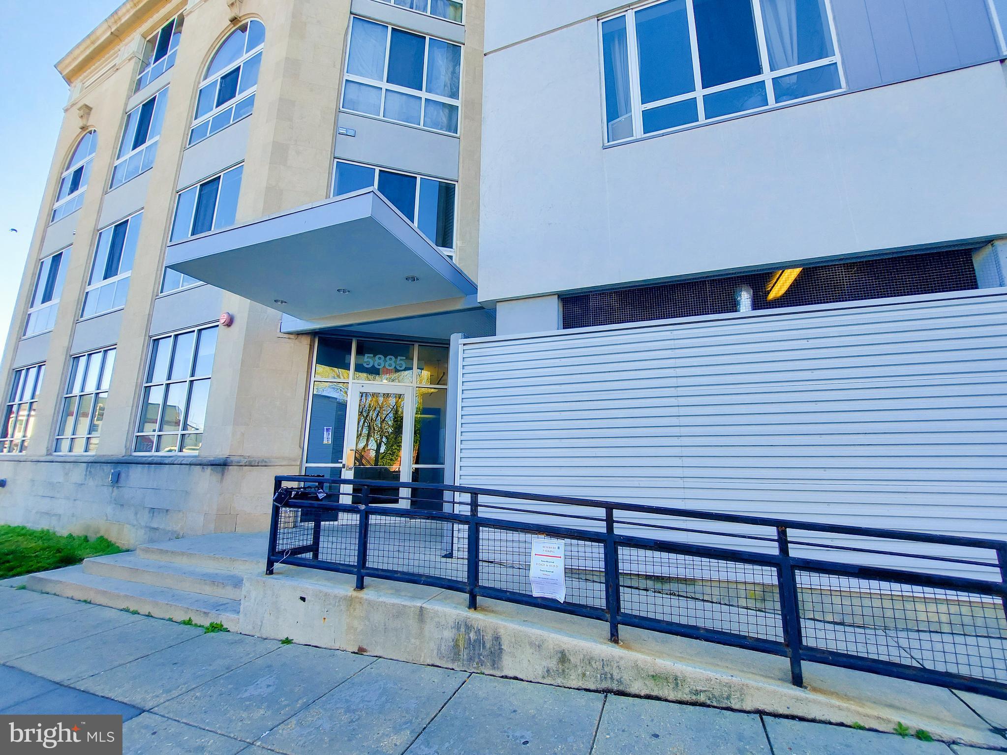 a view of a building with sitting area