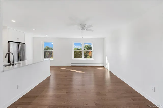 a view of kitchen with stainless steel appliances refrigerator oven and stove