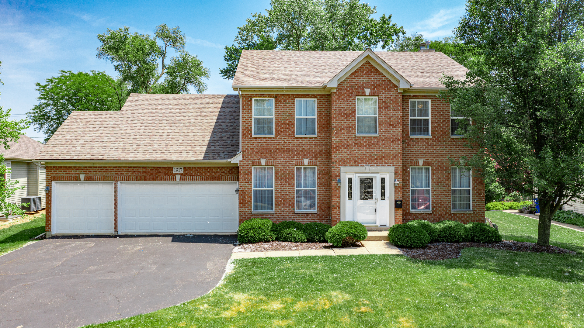 1917 Driving Park Road Wheaton, IL 60187 - Photo 1 of 41 front view of a house with a yard