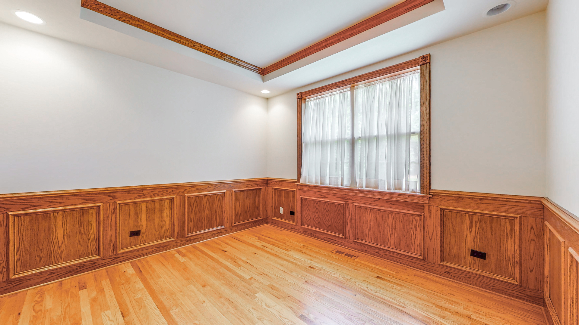 1917 Driving Park Road Wheaton, IL 60187 - Photo 17 of 41 a view of an empty room with wooden floor and a window