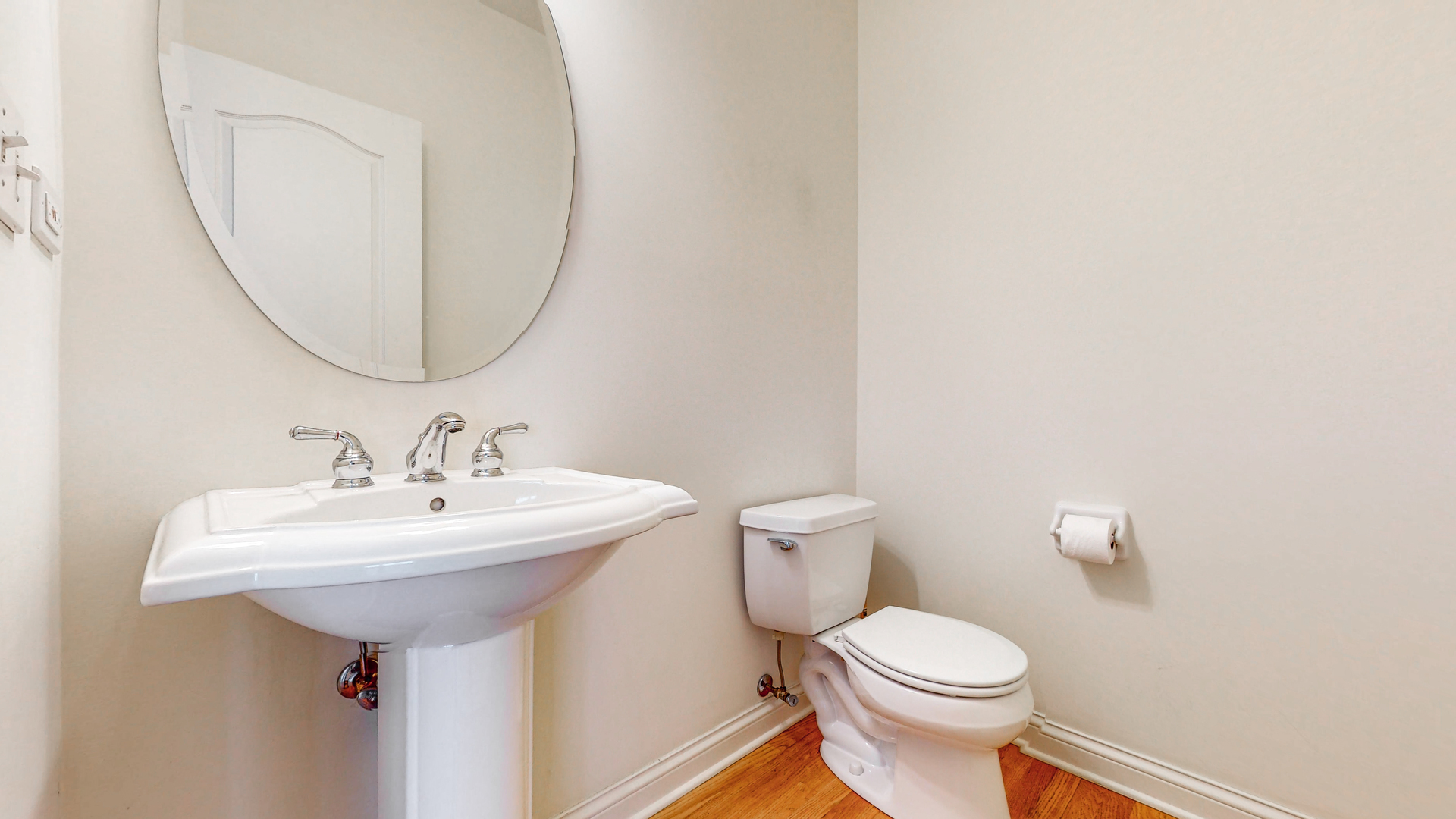 1917 Driving Park Road Wheaton, IL 60187 - Photo 18 of 41 a bathroom with a sink a toilet and a mirror