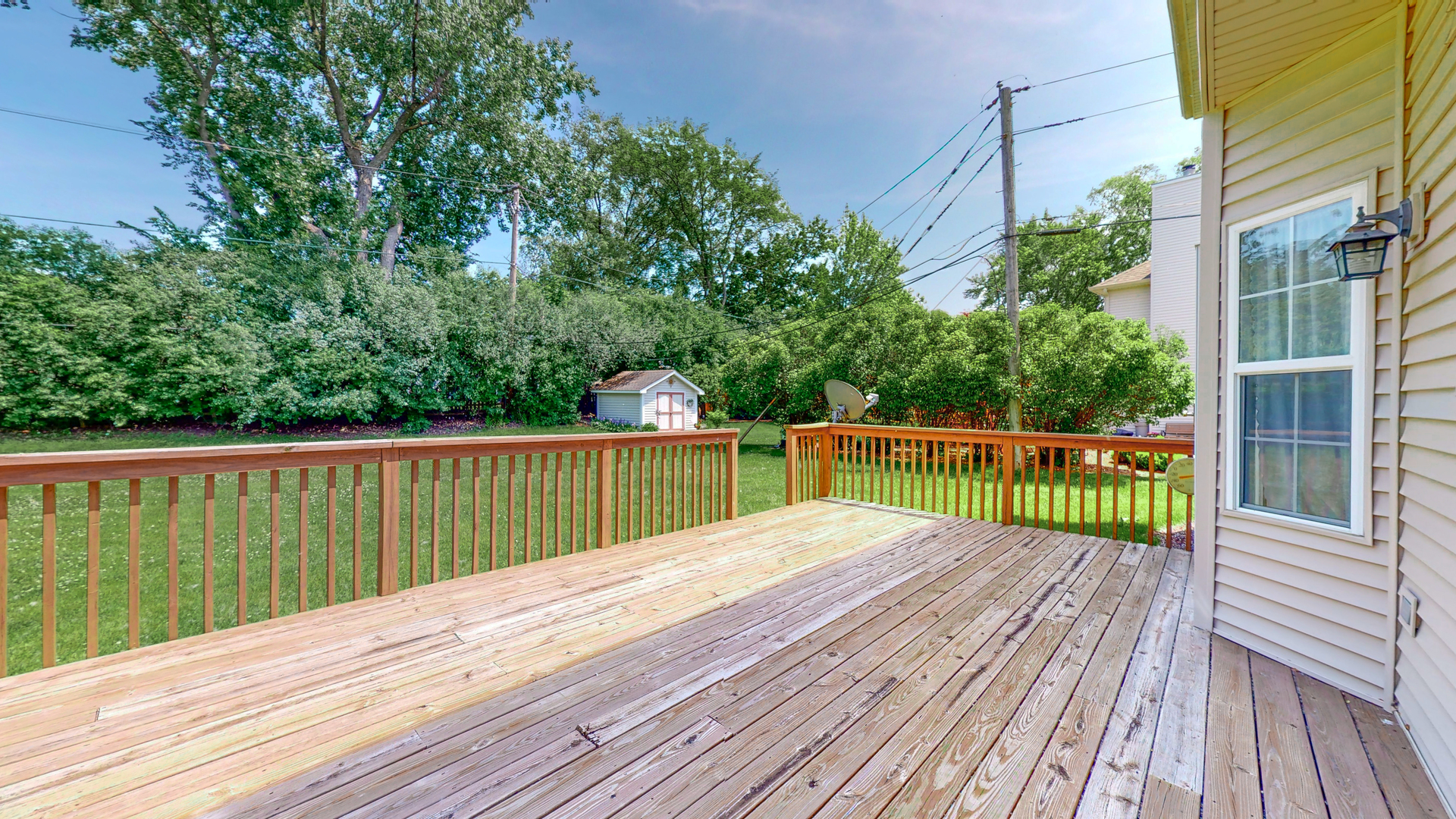 1917 Driving Park Road Wheaton, IL 60187 - Photo 31 of 41 a view of balcony with wooden floor and fence
