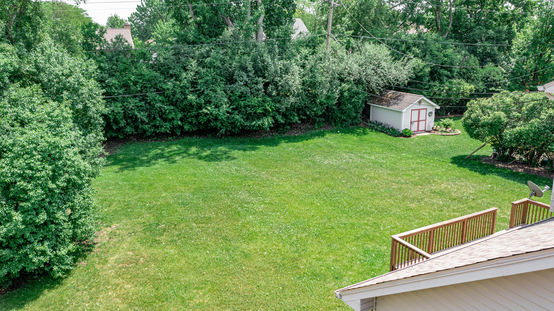 1917 Driving Park Road Wheaton, IL 60187 - Photo 35 of 41 a view of a backyard with a garden and deck