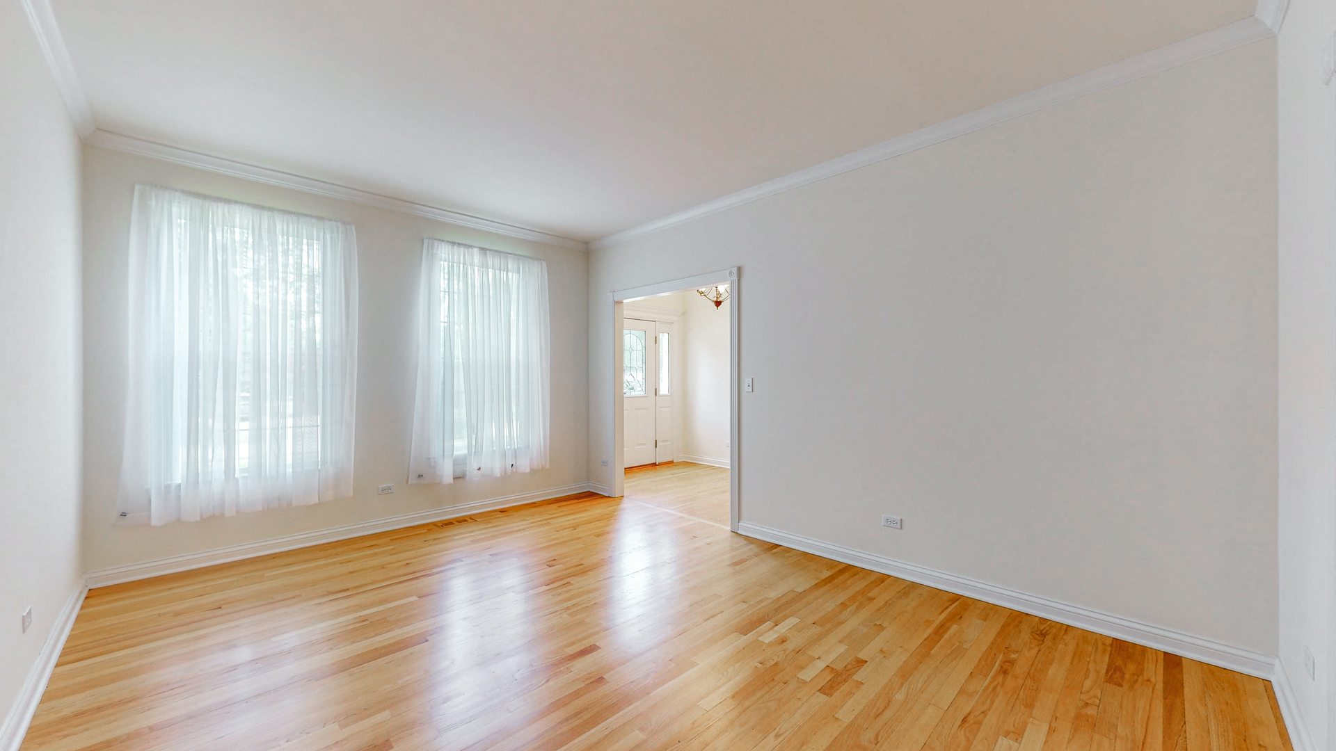 1917 Driving Park Road Wheaton, IL 60187 - Photo 9 of 41 a view of an empty room with wooden floor and a window