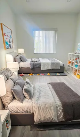 a bedroom with a bed and a couch