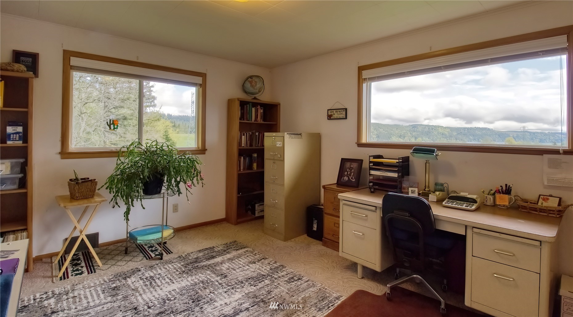 14310 Center Road Quilcene, WA 98376 - Photo 16 of 32 a view of a workspace with furniture and a window