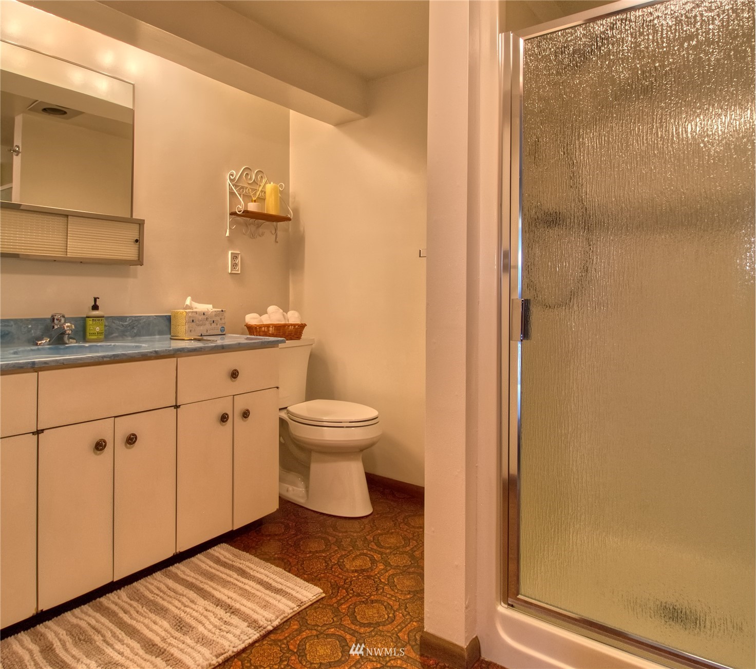 14310 Center Road Quilcene, WA 98376 - Photo 20 of 32 a spacious bathroom with a granite countertop sink and a toilet