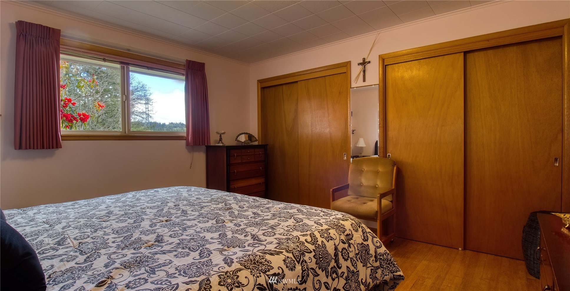 14310 Center Road Quilcene, WA 98376 - Photo 10 of 32 a bedroom with a bed and wooden floor
