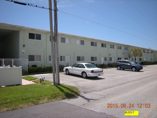 2100 Northeast 38th Street, Unit 216 Lighthouse Point, FL 33064 - Photo 23 of 27 a view of parking with cars parked